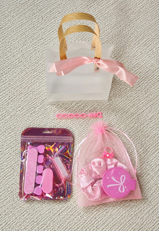 Luxe Party Bag contents with spa-themed treats and accessories from The Little Luxe Co.