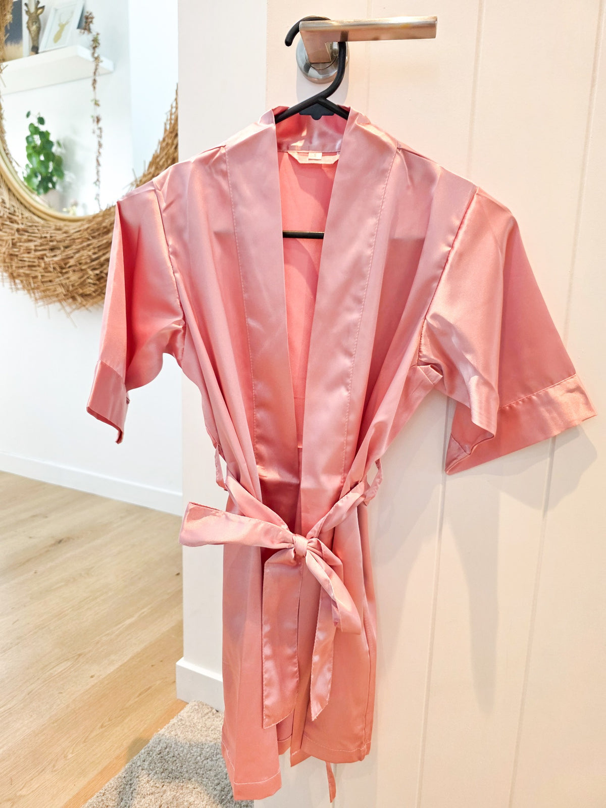 Pink satin children's spa gown included with the Mini Luxe Spa Party.